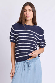Model Genericm wearing size sample of the Blair Stripe Short Sleeve Knit – Whitestrip in colour Whitestrip, in a cropped view
