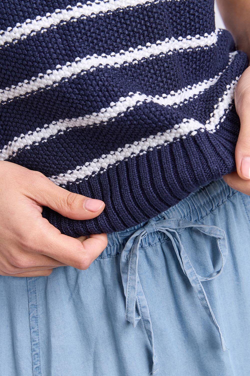 Model Genericm wearing size sample of the Blair Stripe Short Sleeve Knit – Whitestrip in colour Whitestrip, in a cropped view