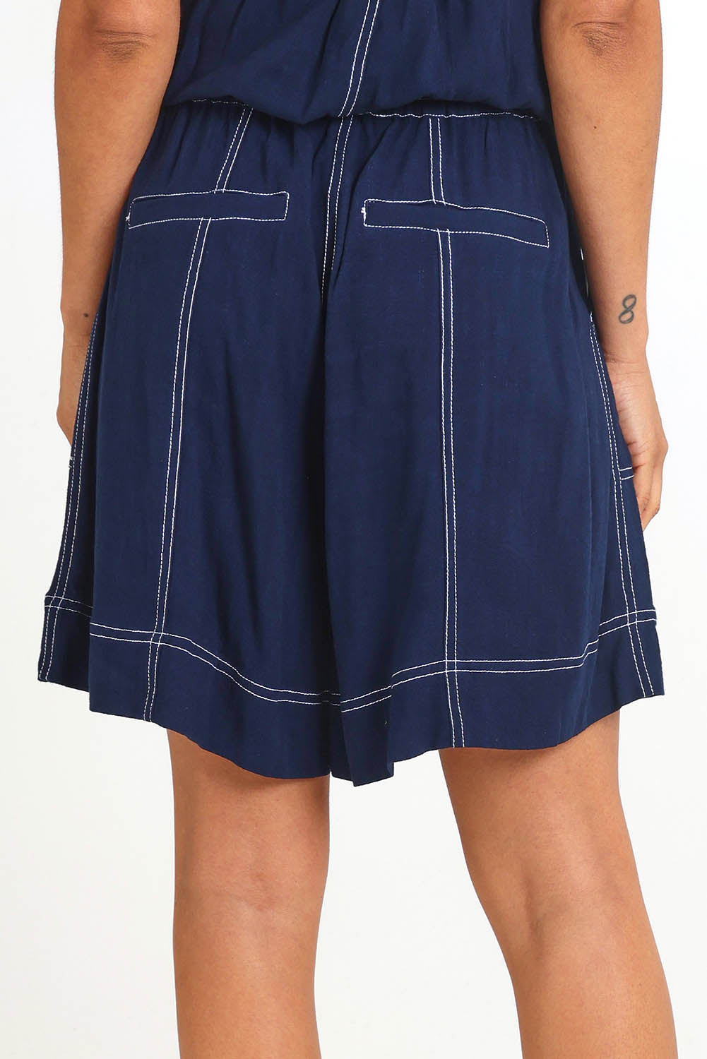 Model Pamelar wearing size 10 of the Sage Short – Dsapphire in colour Dsapphire, from the back