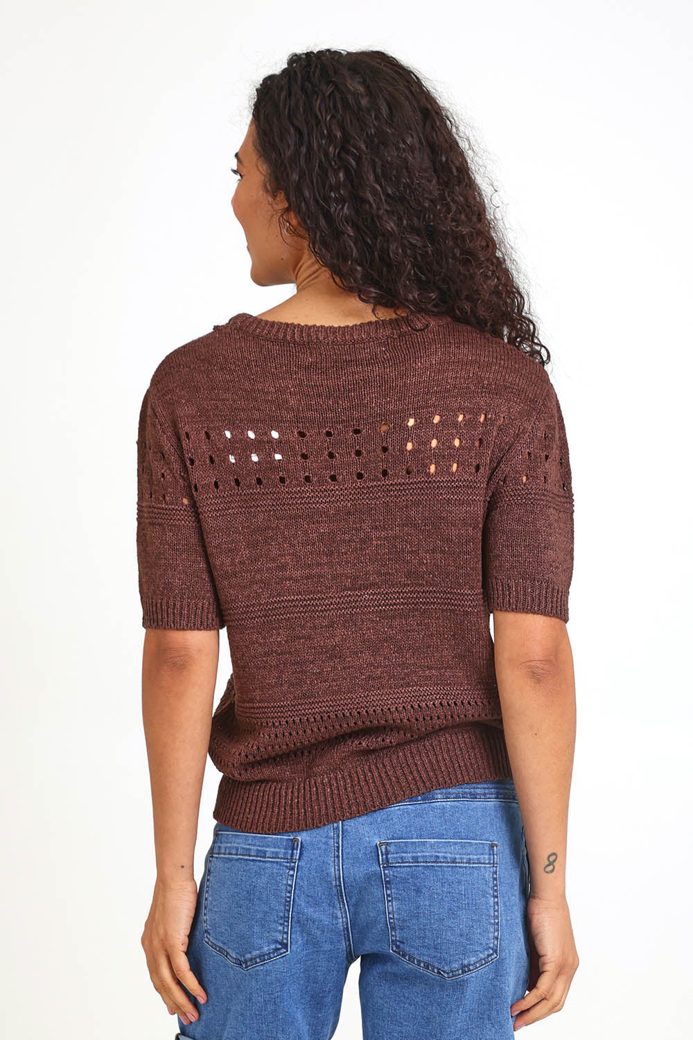 Model Pamelar wearing size 10 of the Sable Knit Top – Chocolate in colour Chocolate, from the back