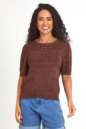 Model Pamelar wearing size 10 of the Sable Knit Top – Chocolate in colour Chocolate, in a cropped view