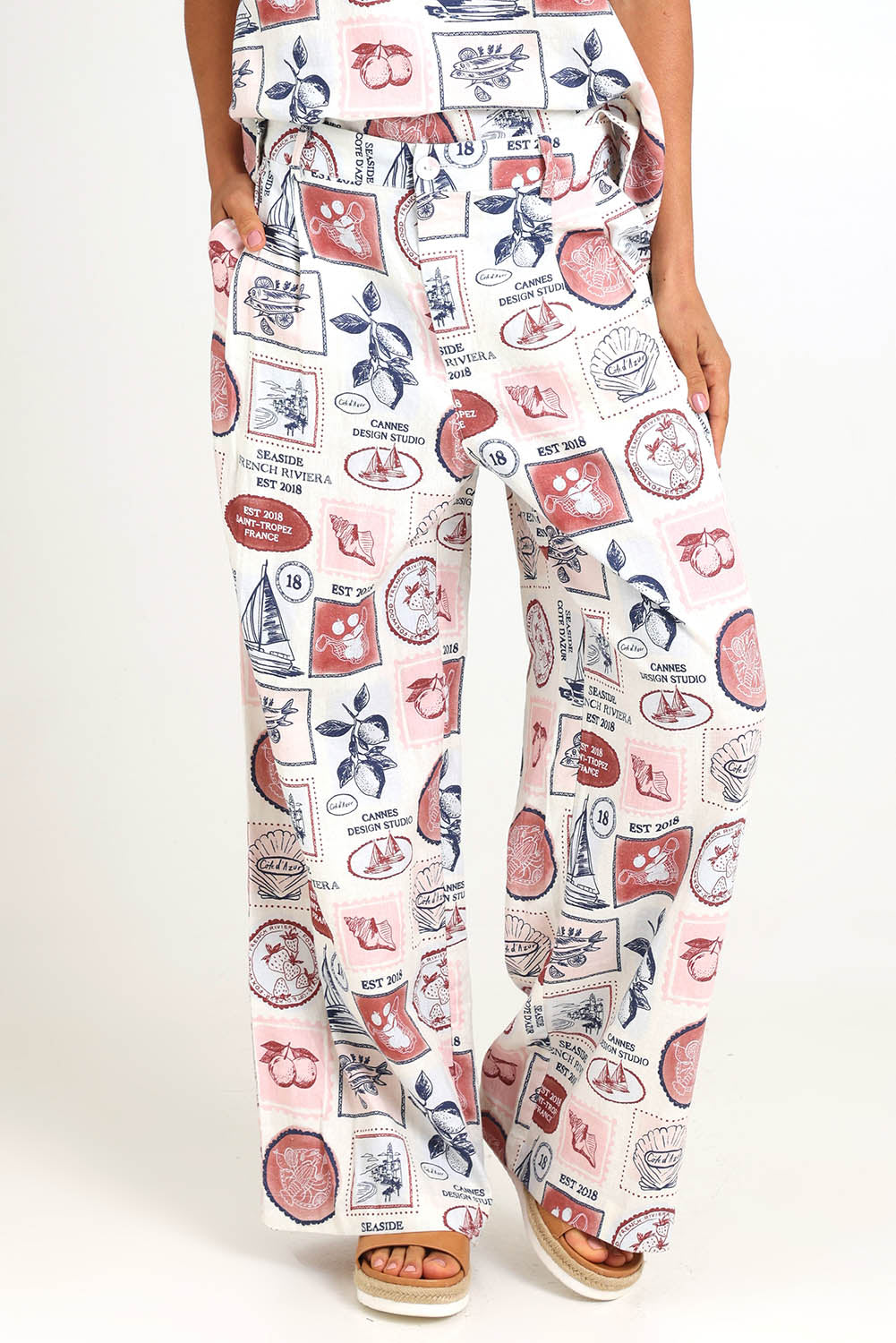 Model Pamelar wearing size 10 of the French Riviera Pant – Frenchprint in colour Frenchprint, from an angle