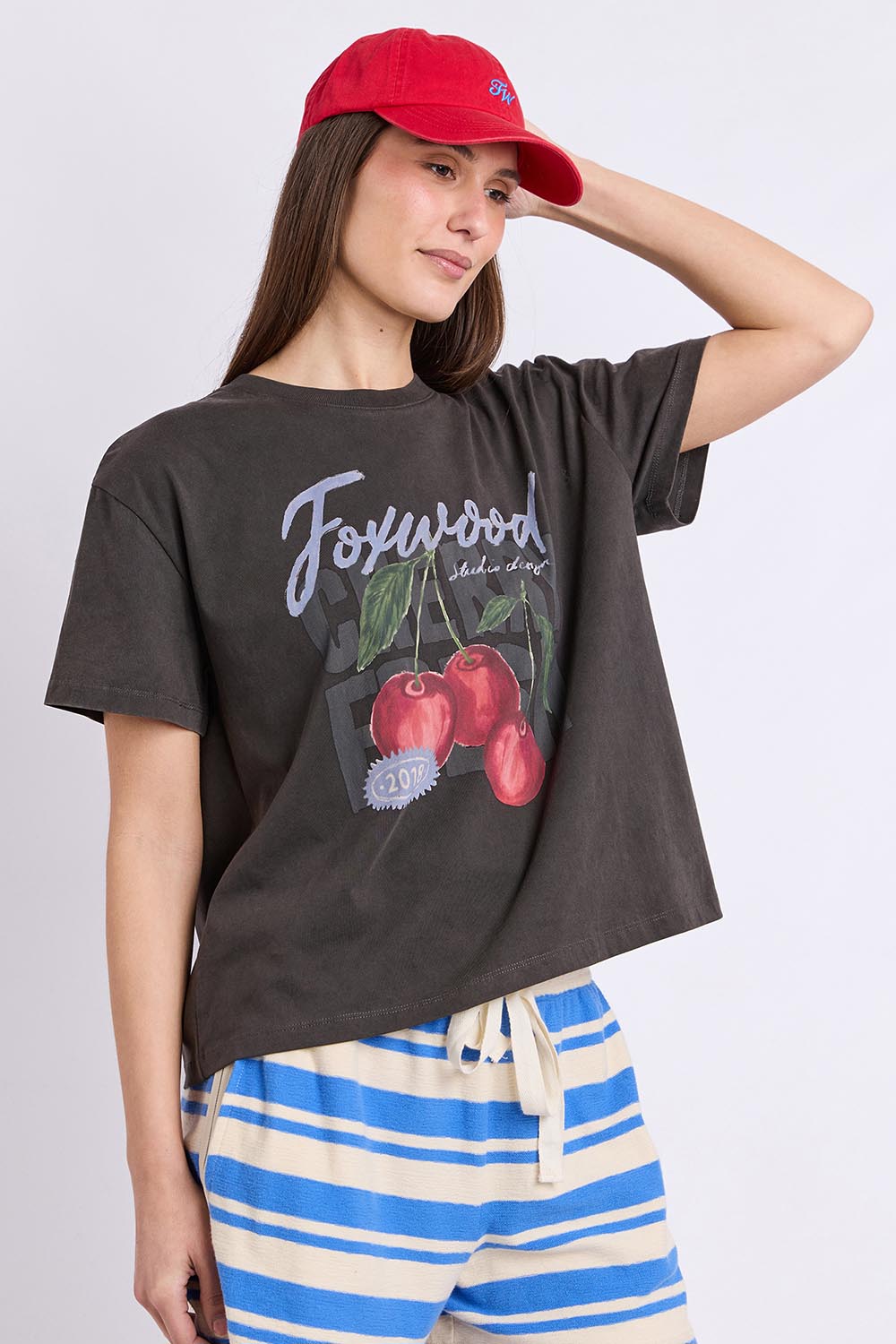 Model Genericm wearing size sample of the Cherry Tee – Wshedblack in colour Wshedblack, in a cropped view