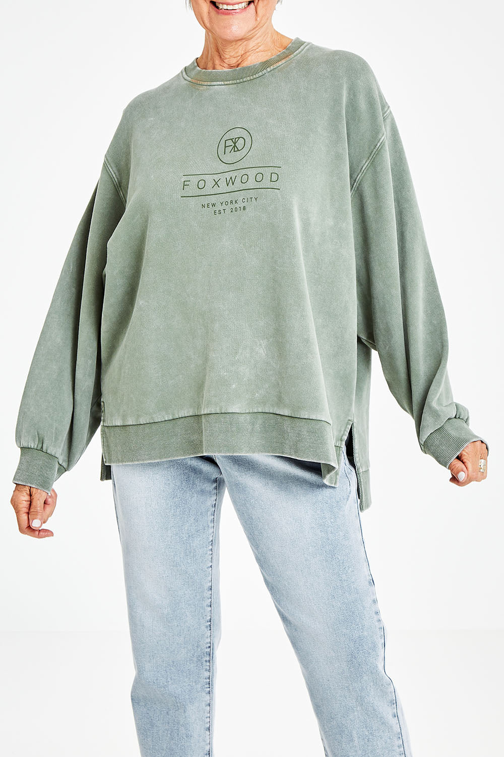Model Elise wearing size 10 of the Everyday Crew in colour Greenmist (Green), from the front, cropped image