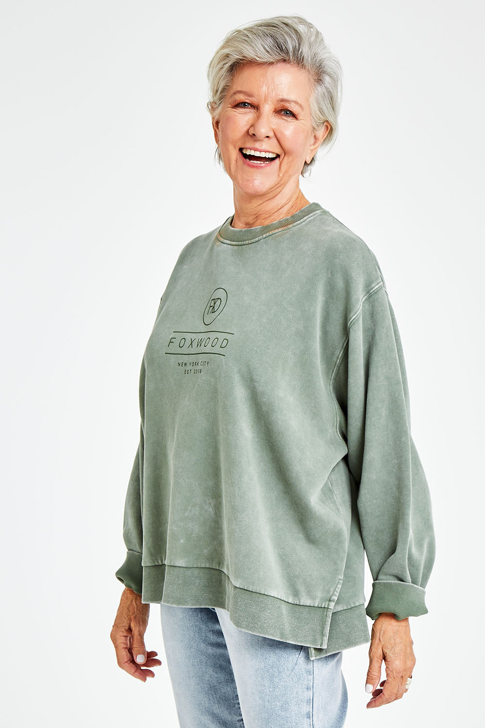 Model Elise wearing size 10 of the Everyday Crew in colour Greenmist (Green), from the front, cropped image