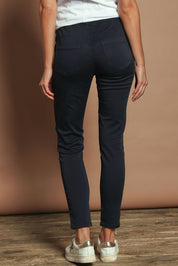 Model Madeline wearing size 10 of the Elements Sylvia Jogger in colour Navy (Blue), from the back