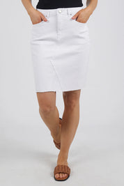 A model wearing the Elements Belle Skirt in colour Cloud (White), from the front, cropped image