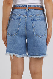 A model wearing the Elements Millie Short in colour Vintageblu (Blue), from the back