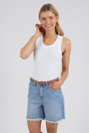 A model wearing the Elements Millie Short in colour Vintageblu (Blue), from the front, cropped image