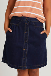 Model Olivia wearing size 10 of the Elements Amanda Skirt in colour Indigoden (Blue), from the front, cropped image