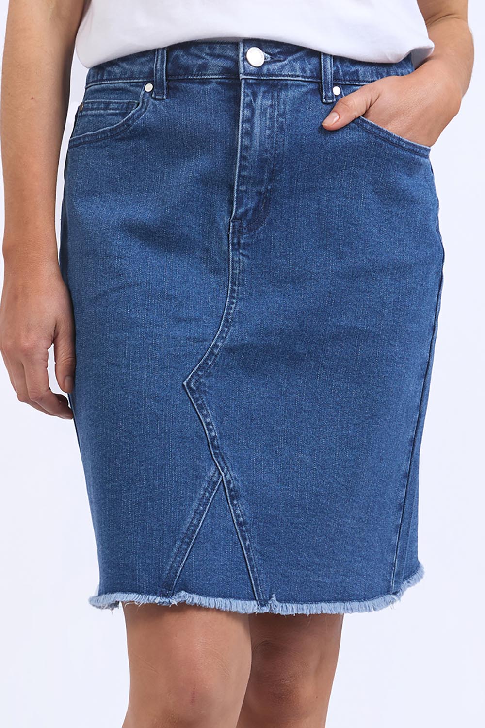A model wearing the Elements Belle Skirt in colour Midblue (Blue), from the front, cropped image