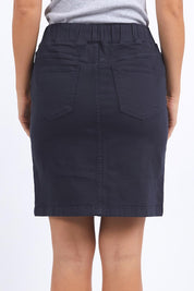 A model wearing the Elements Rio Skirt in colour Navy (Blue), from the back