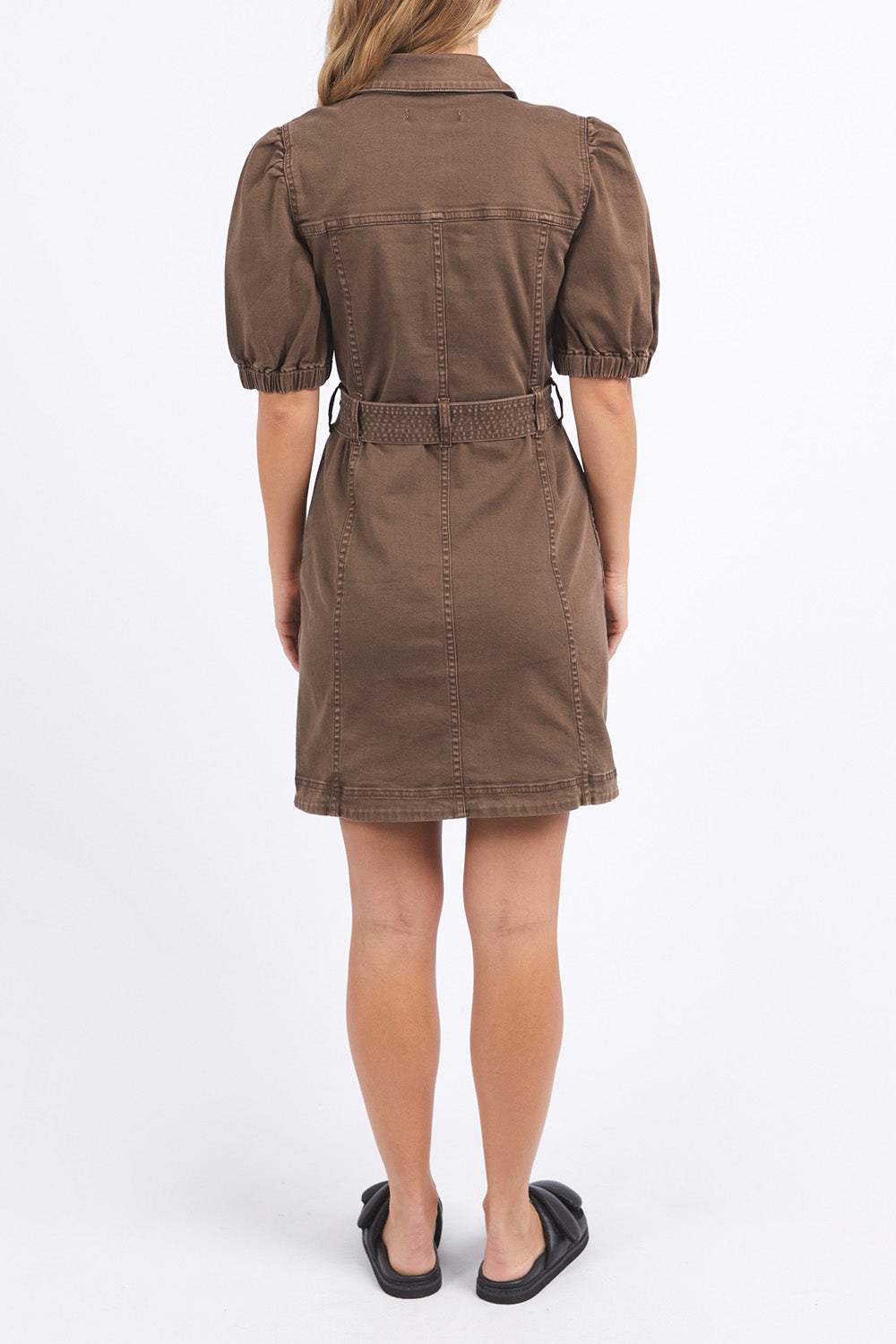 A model wearing the Talbert Dress in colour Chocolate, from the back