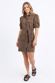 A model wearing the Talbert Dress in colour Chocolate, from the front, showing the whole outfit
