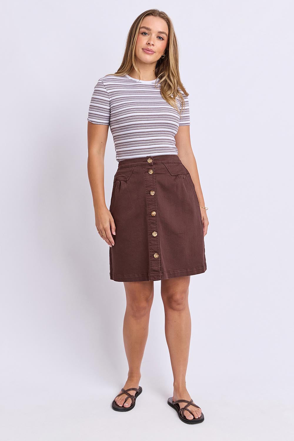 Model Genericm wearing size sample of the Elements Amanda Denim Skirt – Chocolate in colour Chocolate, from the front