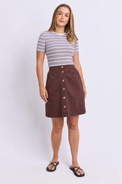 Model Genericm wearing size sample of the Elements Amanda Denim Skirt – Chocolate in colour Chocolate, from the front
