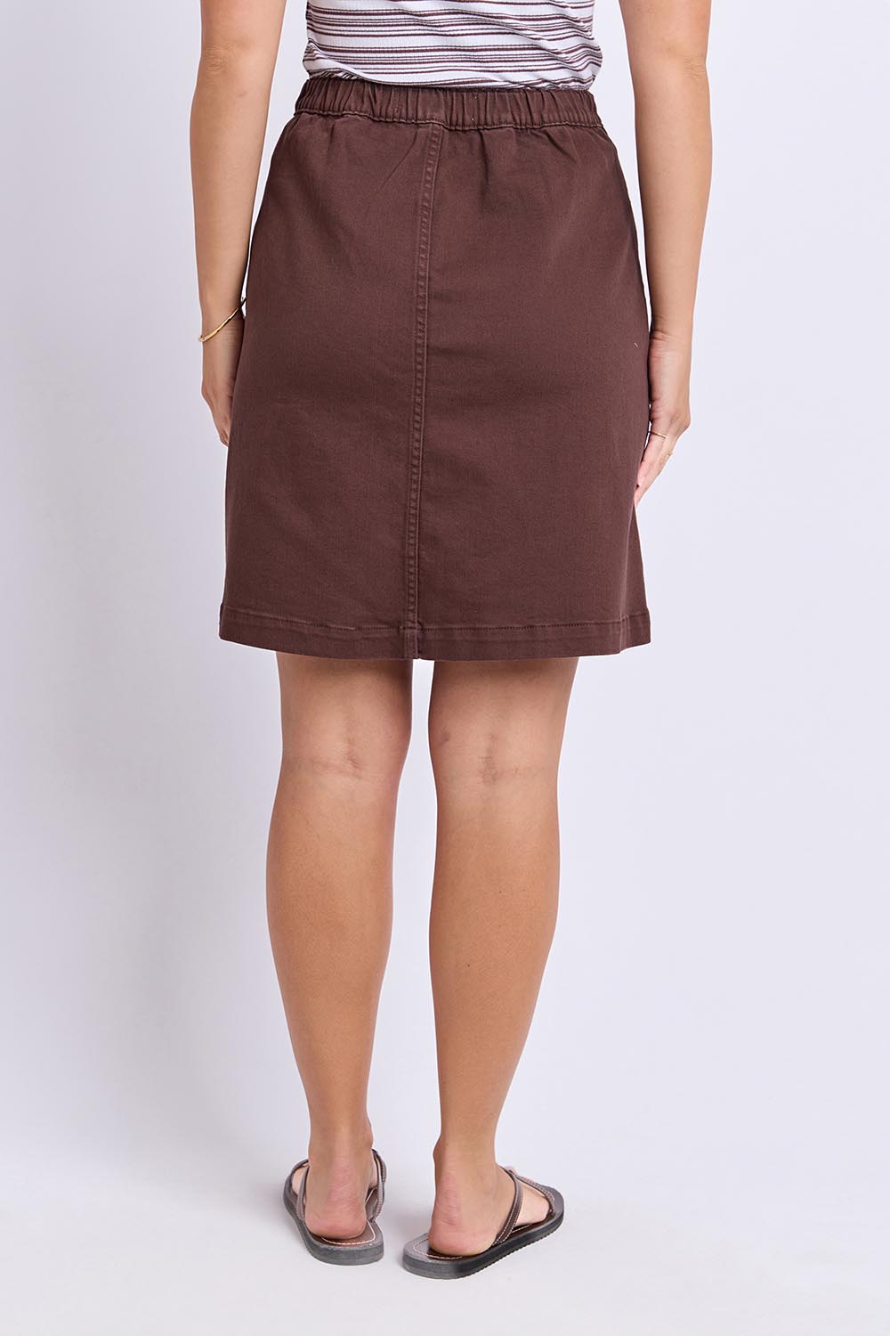 Model Genericm wearing size sample of the Elements Amanda Denim Skirt – Chocolate in colour Chocolate, from the front
