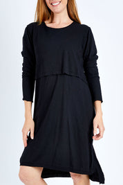 Model Katie wearing size 10 of the Elements Highline Long Sleeve Dress in colour Black (Black), from the front, cropped image