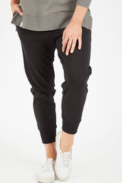 Model Hayley wearing size 10 of the Chelsea Pant in colour Black (Black), from the front, cropped image