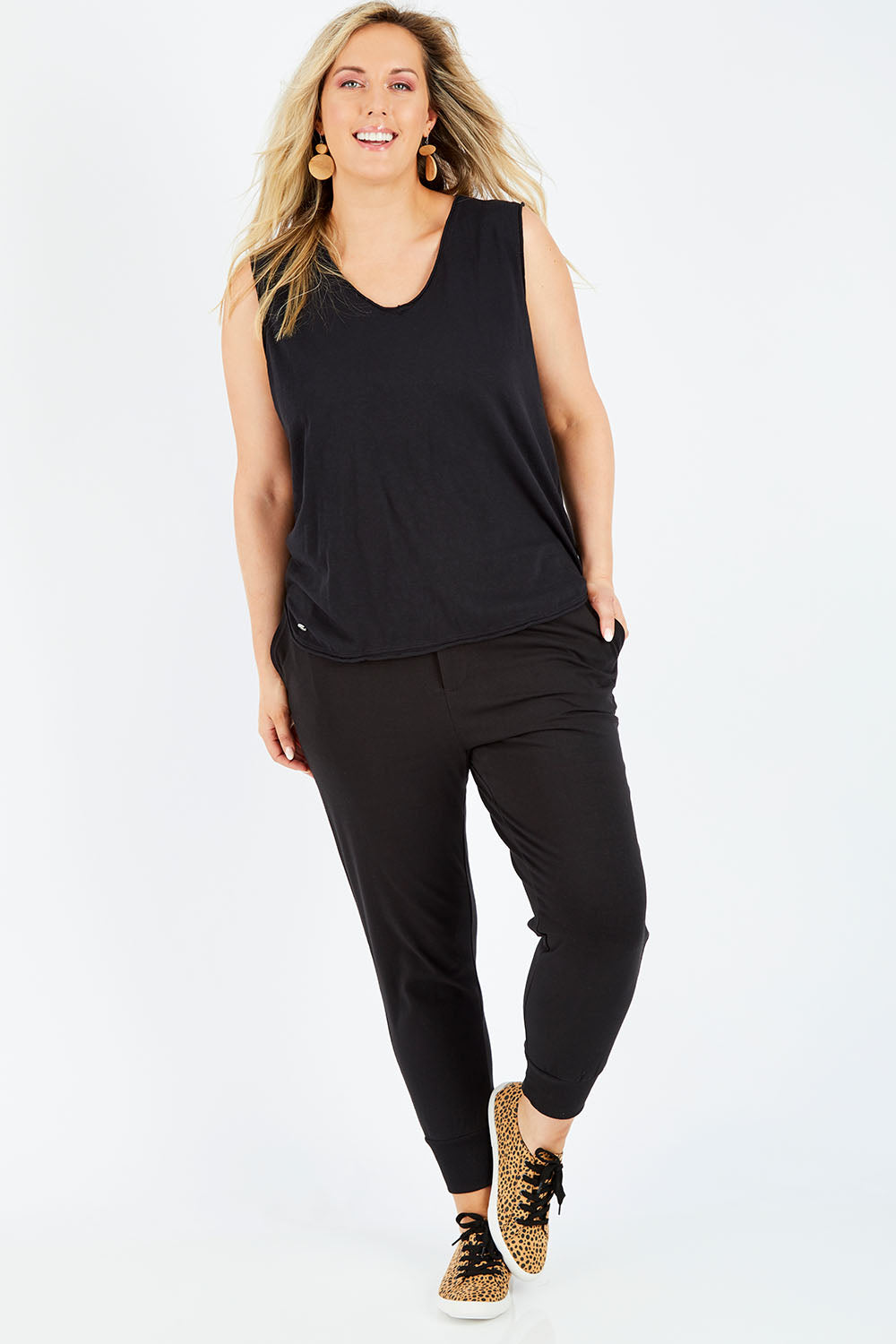 Model Jess wearing size 14 of the Chelsea Pant in colour Black (Black), from the front, showing the whole outfit