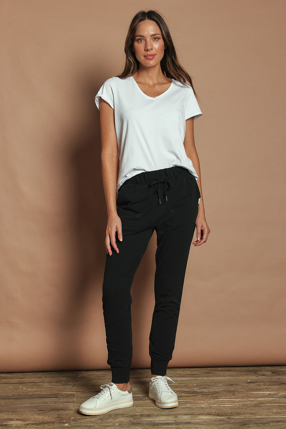 Model Madeline wearing size 10 of the Elements Lazy Days Pant in colour Black (Black), from the front, showing the whole outfit