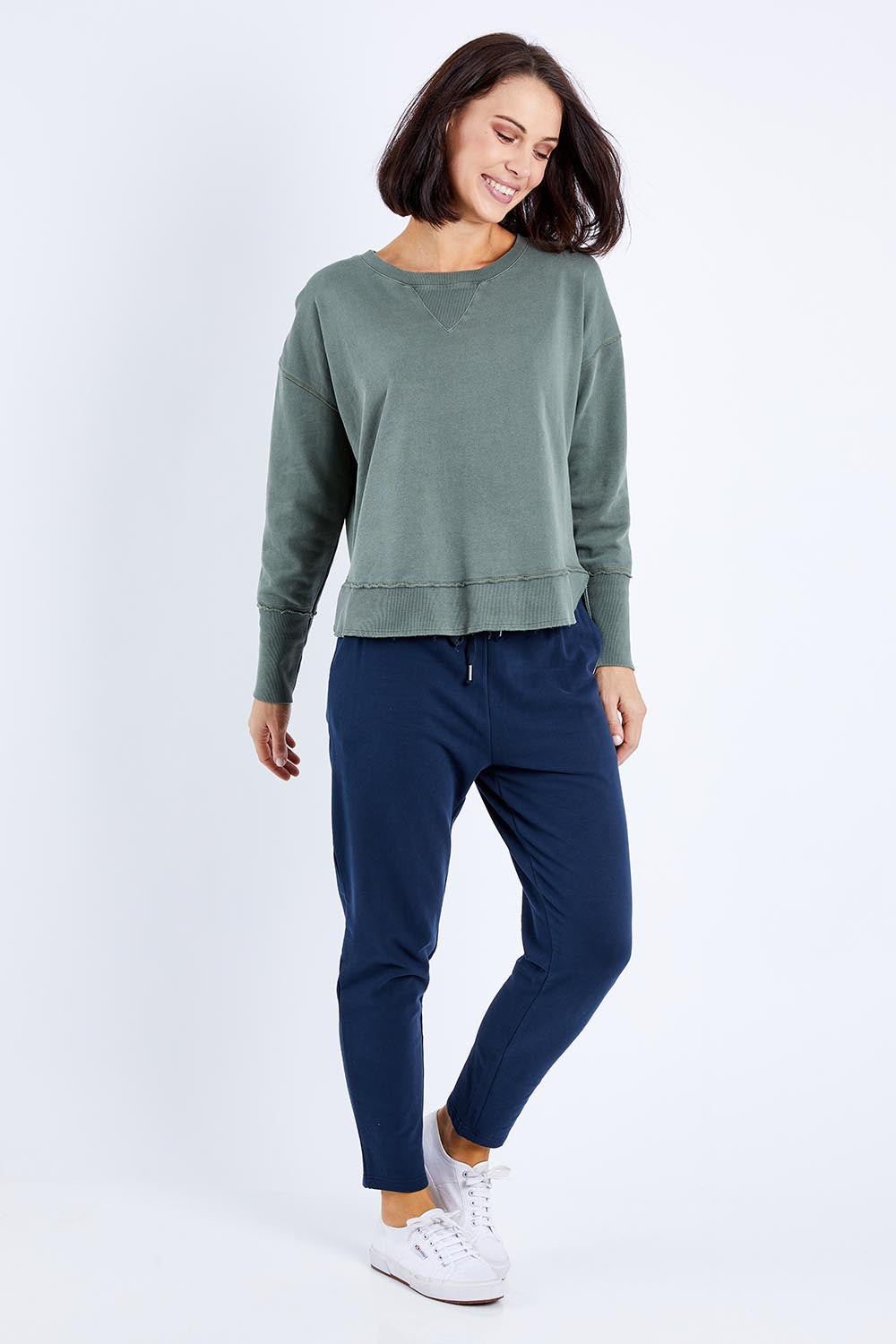 Model Andrea wearing size 10 of the Elements Delilah Crew in colour Khaki (Green), from the front, showing the whole outfit