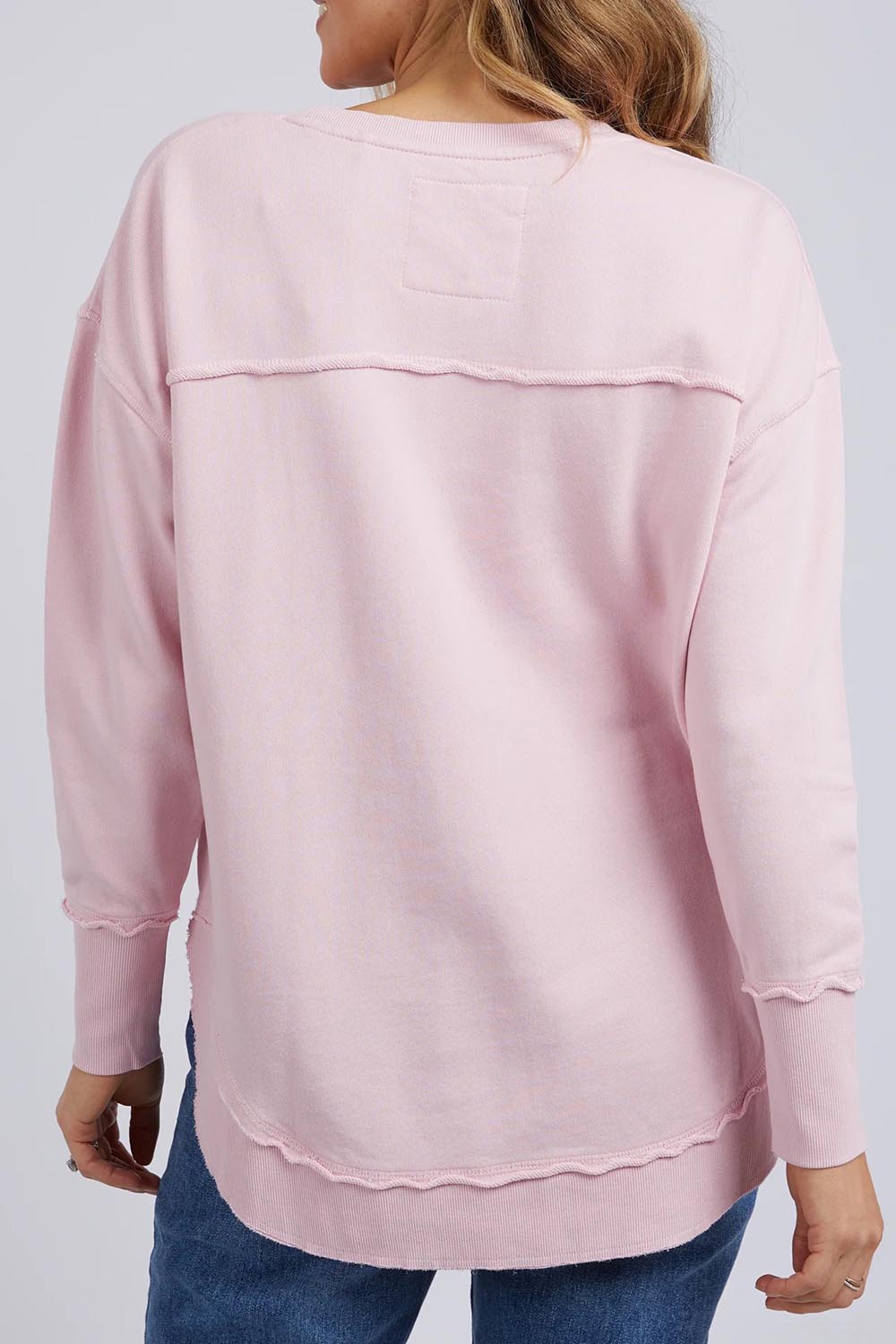 A model wearing the Elements Simplified Cotton Crew in colour Blossom (Pink), from the back