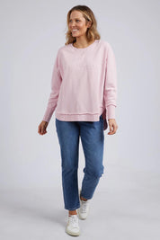 A model wearing the Elements Simplified Cotton Crew in colour Blossom (Pink), from the front, showing the whole outfit