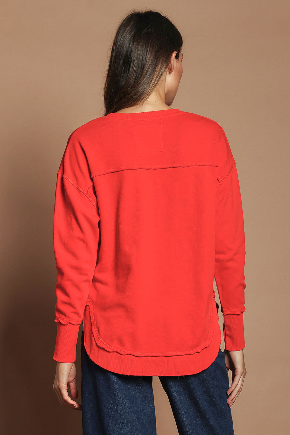 Model Madeline wearing size 10 of the Elements Simplified Cotton Crew in colour Brightred (Red), from the back