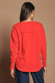Model Madeline wearing size 10 of the Elements Simplified Cotton Crew in colour Brightred (Red), from the back