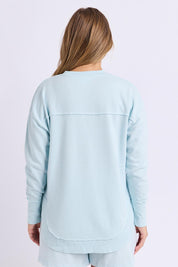 Model Genericm wearing size sample of the Elements Simplified Cotton Crew – Coolblue in colour Coolblue, from the back