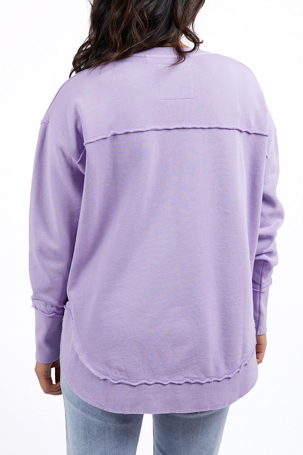 A model wearing the Elements Simplified Cotton Crew in colour Lavender (Purple), from the back