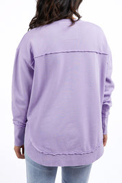 A model wearing the Elements Simplified Cotton Crew in colour Lavender (Purple), from the back
