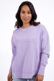 A model wearing the Elements Simplified Cotton Crew in colour Lavender (Purple), from the front, cropped image