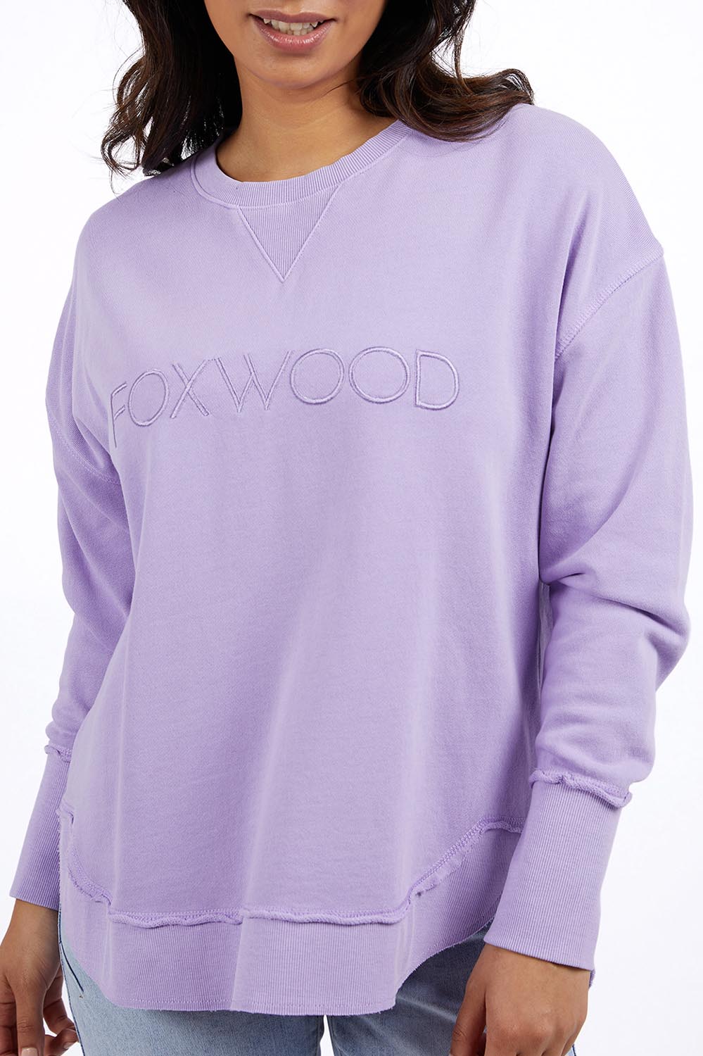A model wearing the Elements Simplified Cotton Crew in colour Lavender (Purple), from the front, cropped image