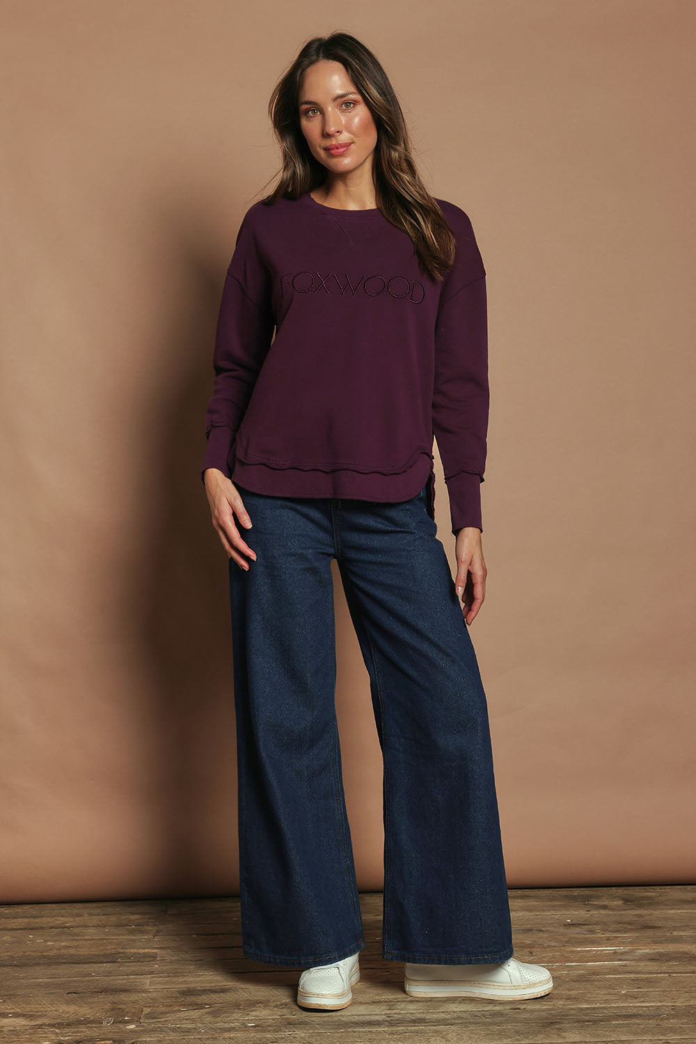 Model Madeline wearing size 10 of the Elements Simplified Cotton Crew in colour Plum (Purple), from the front, showing the whole outfit