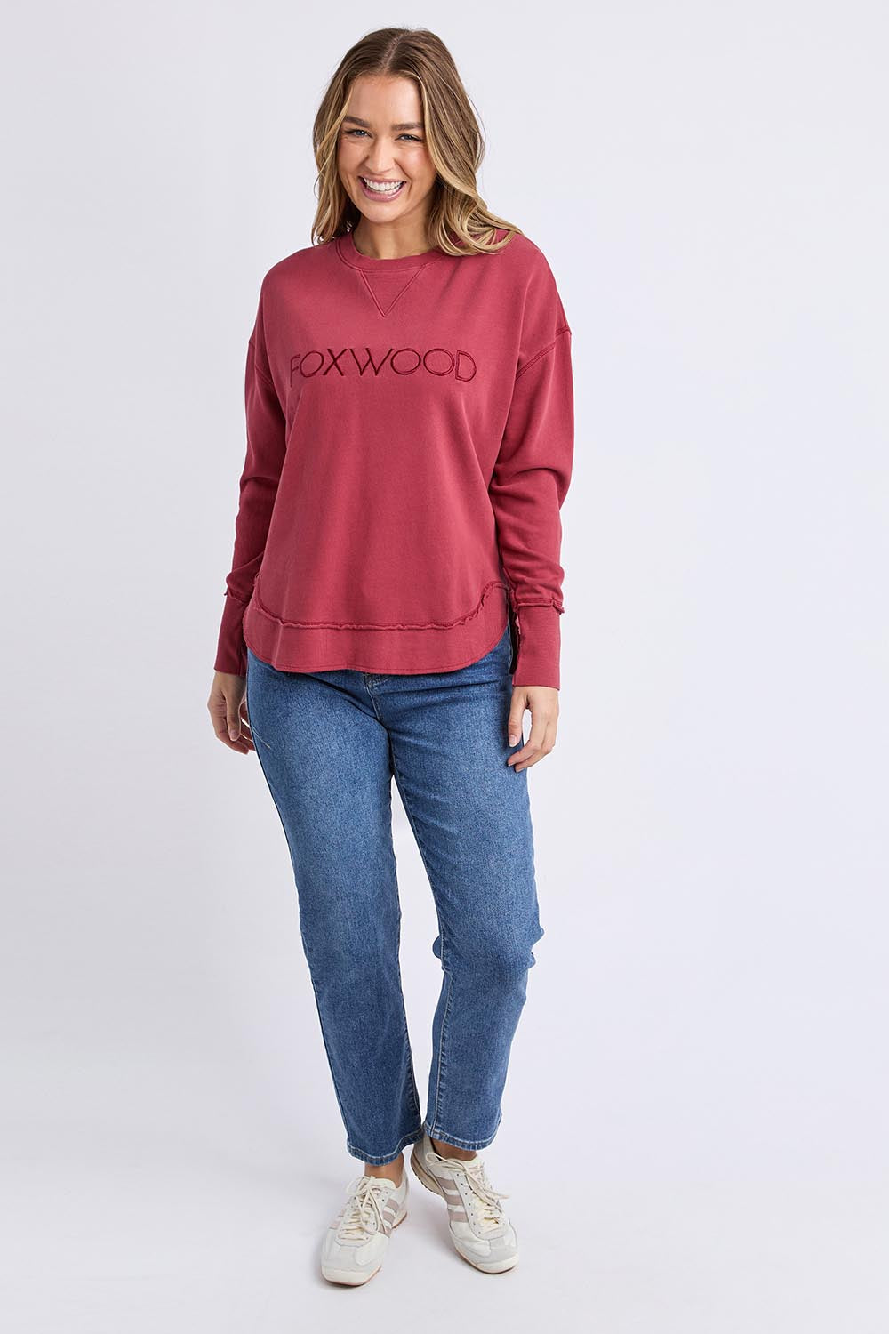 A model wearing the Elements Simplified Cotton Crew in colour Rust (Red), from the front, showing the whole outfit