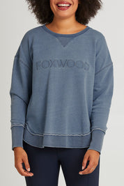 Model Olivia wearing size 10 of the Elements Washed Simplified Crew in colour Blue (Blue), from the front, cropped image