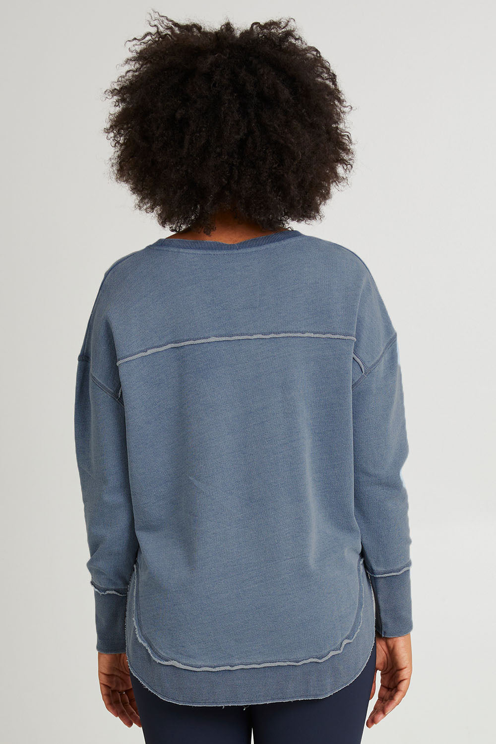 Model Olivia wearing size 10 of the Elements Washed Simplified Crew in colour Blue (Blue), from the front, cropped image