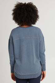 Model Olivia wearing size 10 of the Elements Washed Simplified Crew in colour Blue (Blue), from the front, cropped image