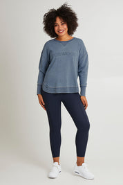 Model Olivia wearing size 10 of the Elements Washed Simplified Crew in colour Blue (Blue), from the front, showing the whole outfit