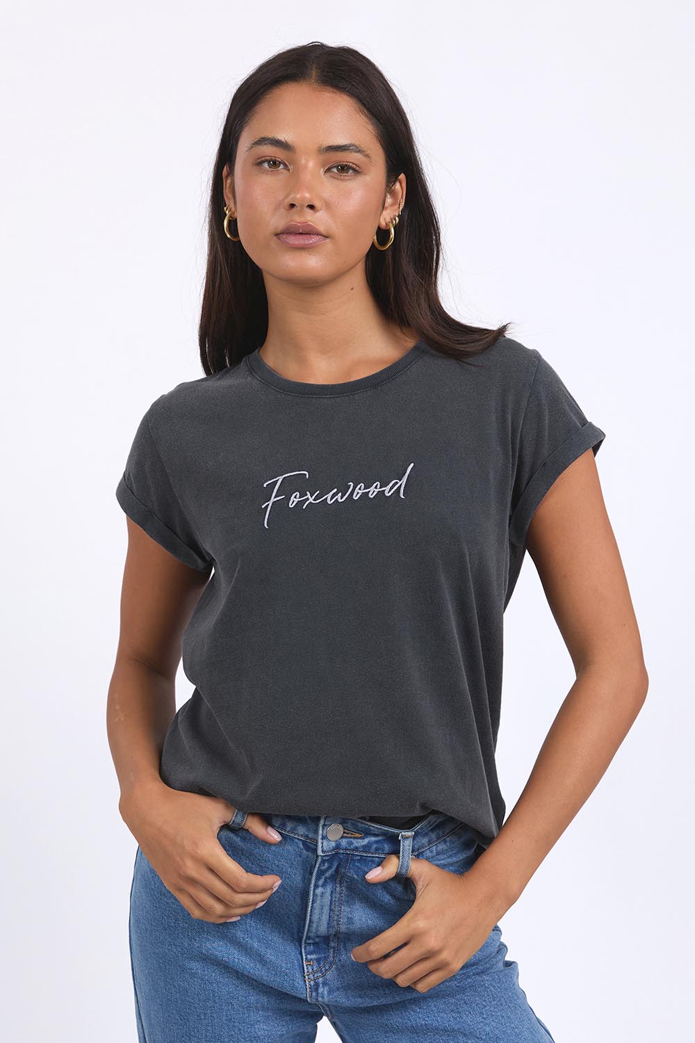 A model wearing the Elements Signature Cotton Tee in colour Black (Black), from the front, cropped image