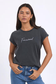 A model wearing the Elements Signature Cotton Tee in colour Black (Black), from the front, cropped image