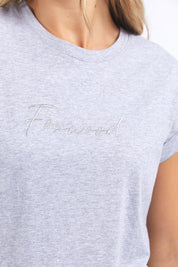 A model wearing the Elements Signature Cotton Tee in colour Greymarle (Grey), from the front, cropped image