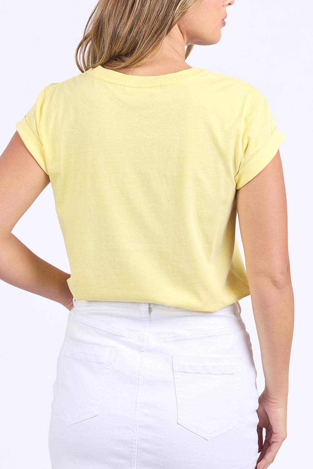 A model wearing the Elements Signature Cotton Tee in colour Lemon, from the back