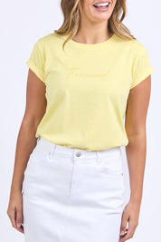 A model wearing the Elements Signature Cotton Tee in colour Lemon, from the front, cropped image