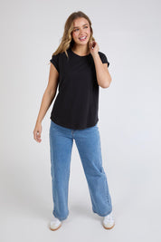 A model wearing the Elements Manly Cotton Tee in colour Black (Black), from the front, showing the whole outfit