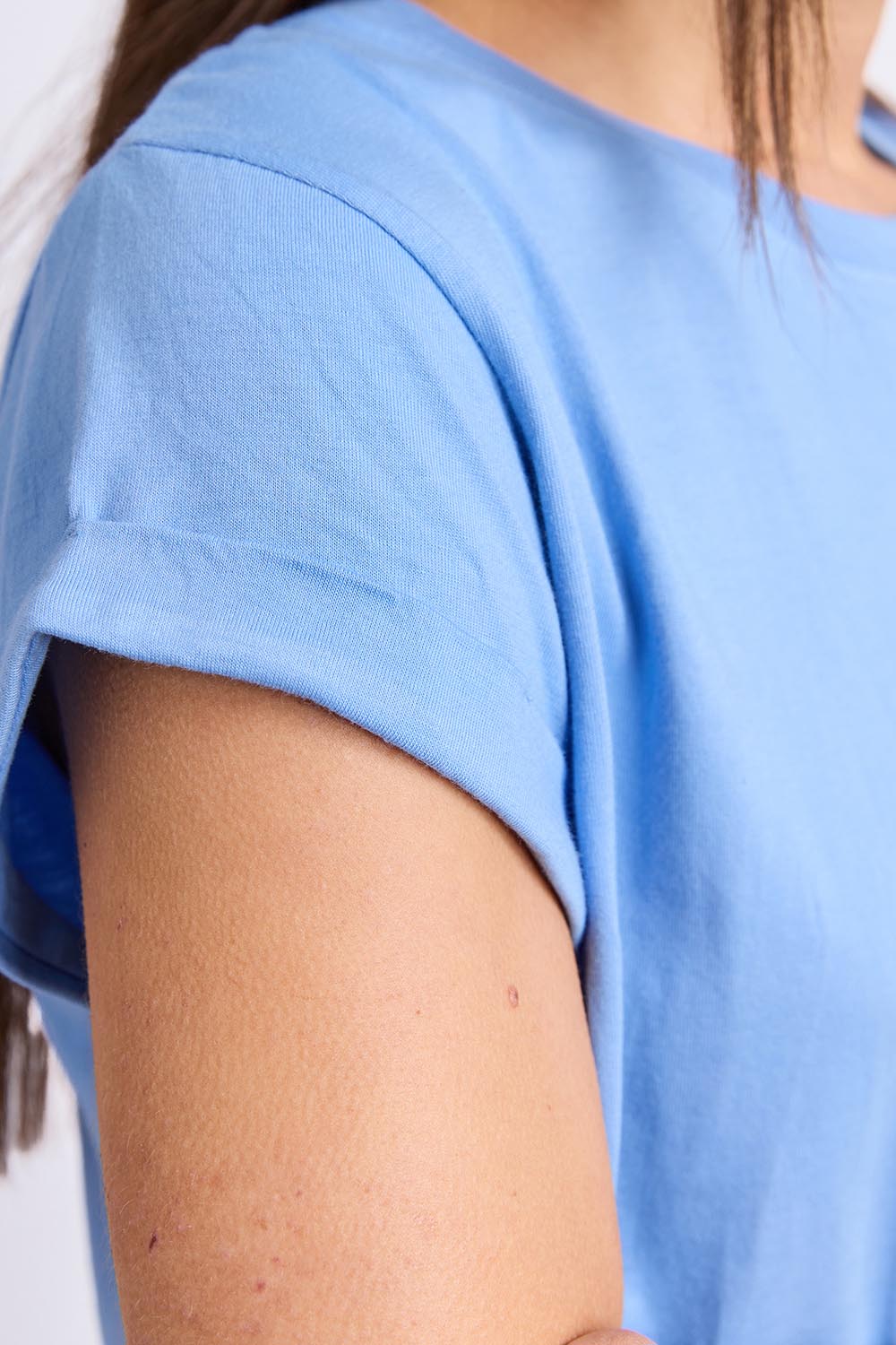 Model Genericm wearing size sample of the Elements Manly Cotton Tee - Cornflower in colour Cornflower, from an angle
