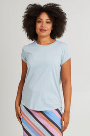 Model Olivia wearing size 10 of the Elements Manly Cotton Tee in colour Dreamblue (Blue), from the front, cropped image
