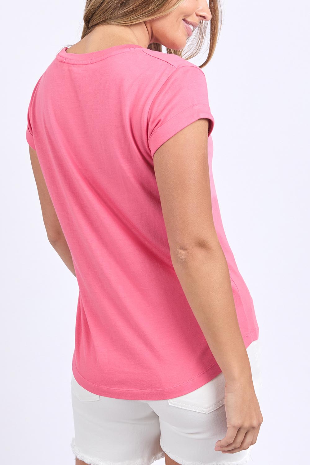 A model wearing the Elements Manly Cotton Tee in colour Hotpink (Pink), from the back